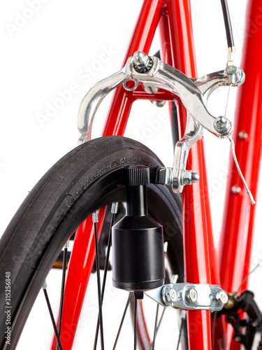 Bicycle dynamo fixed to back wheel photo