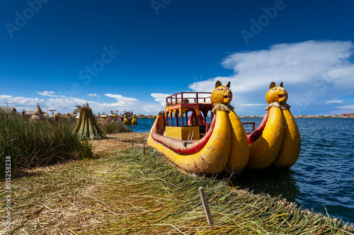 Close-up traditional reed boat as transportation for tourists, floating Uros islands on lake Titicaca in Peru, South America.