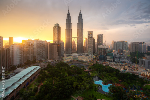 Kuala Lumpur city skyscraper and green space park with nice sky sunset at downtown business district in Kuala Lumpur. Malaysia. Malaysia tourism, modern city life, or business finance and economy