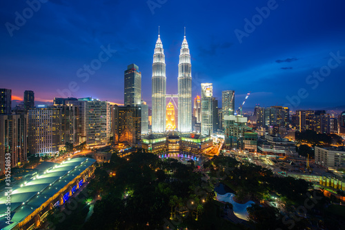 Photography Kuala Lumpur city skyscraper and green space park with nice sky sunset at downtown business district in Kuala Lumpur