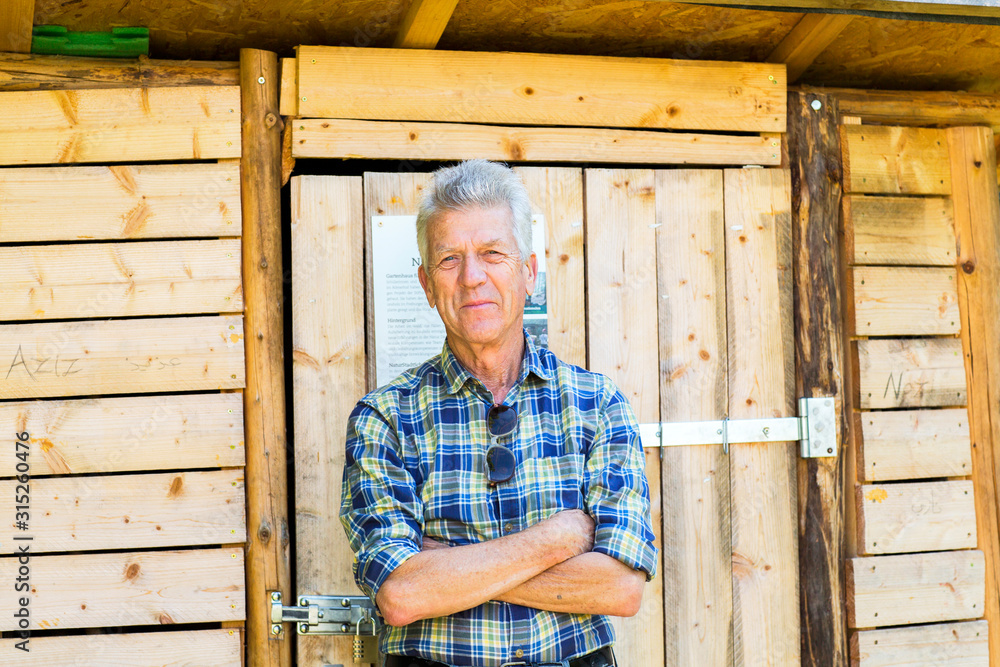 Man outside garden shed Man outside garden shed