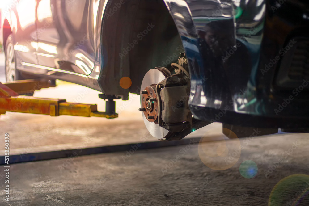 Fototapeta premium Brake pad machine The mechanic is working
