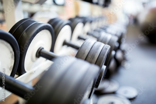 Close-up of dumbbells in row photo