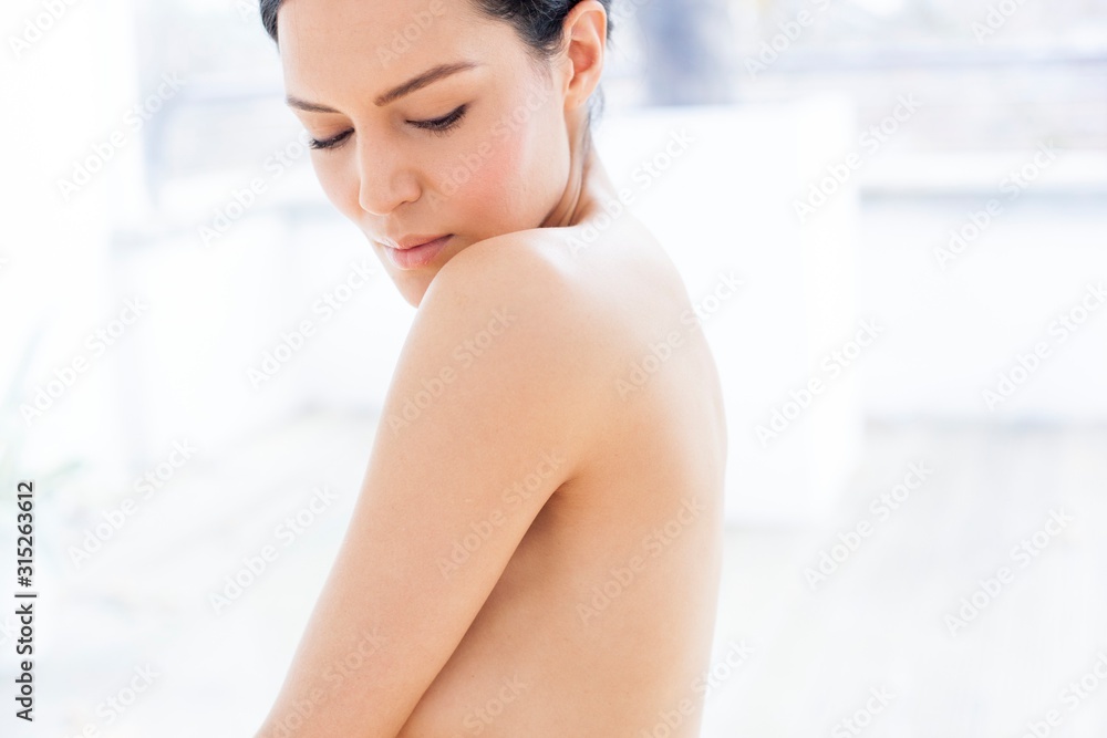 Woman looking over shoulder Woman looking over shoulder