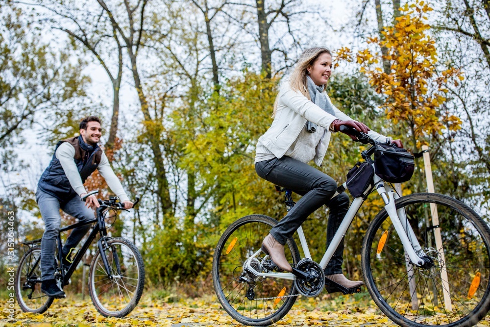 Couple cycling together Couple cycling together