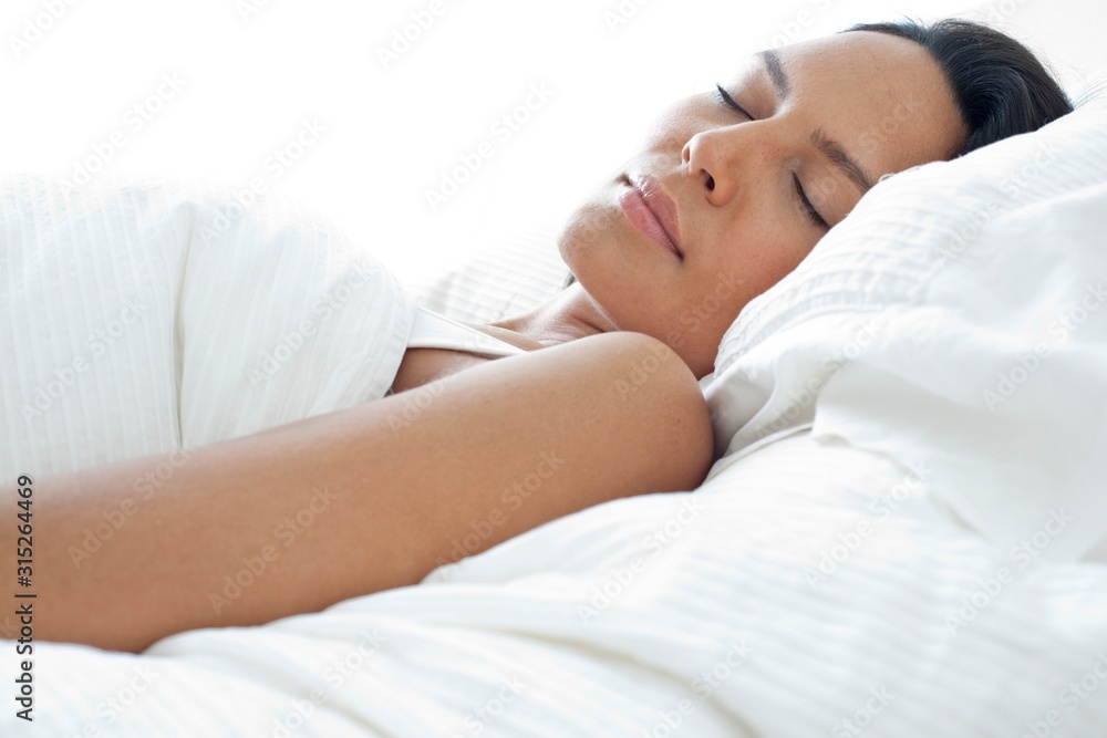 Young woman asleep in bed Young woman asleep in bed