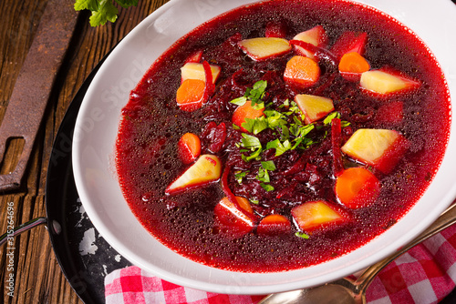 Delicious beetroot borscht with egg photo