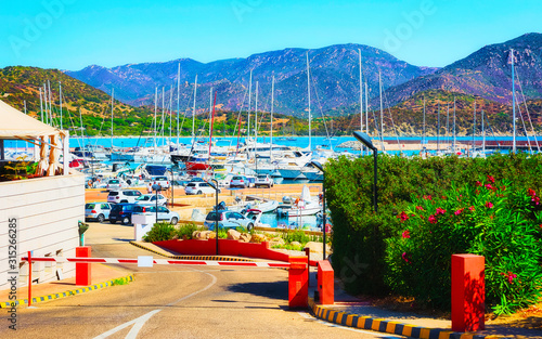 Old Sardinian Port and marina with ships at Mediterranean Sea in city of Villasimius in South Sardinia Island Italy in summer. Cityscape with Yachts and boats © Roman Babakin
