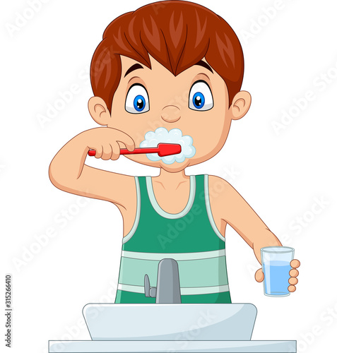 Cute little boy brushing teeth