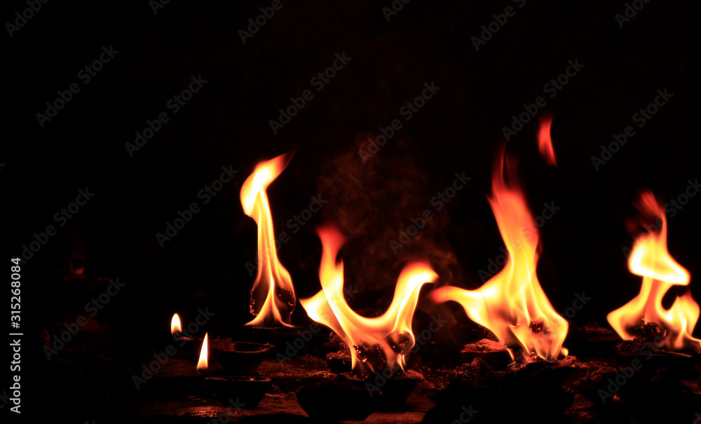 Fototapeta premium burning fire in night.The holy fire used for the offering during a ritual 