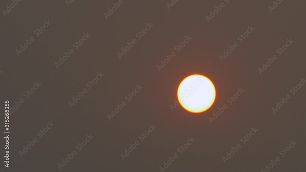 Sun Setting In Think Smokey Sky, Smoke From Australian Bush Fires. FAST MOTION Sun Setting In Think Smokey Sky, Smoke From Australian Bush Fires. FAST MOTION