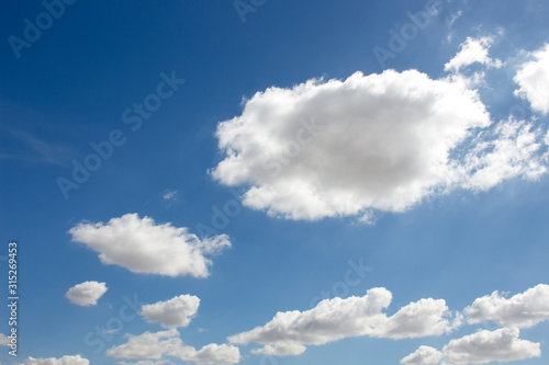 Bright blue sky with white clouds for background or wallpapers