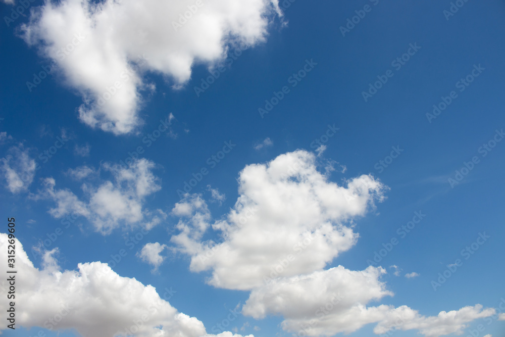Obraz premium Bright blue sky with white clouds for background or wallpapers