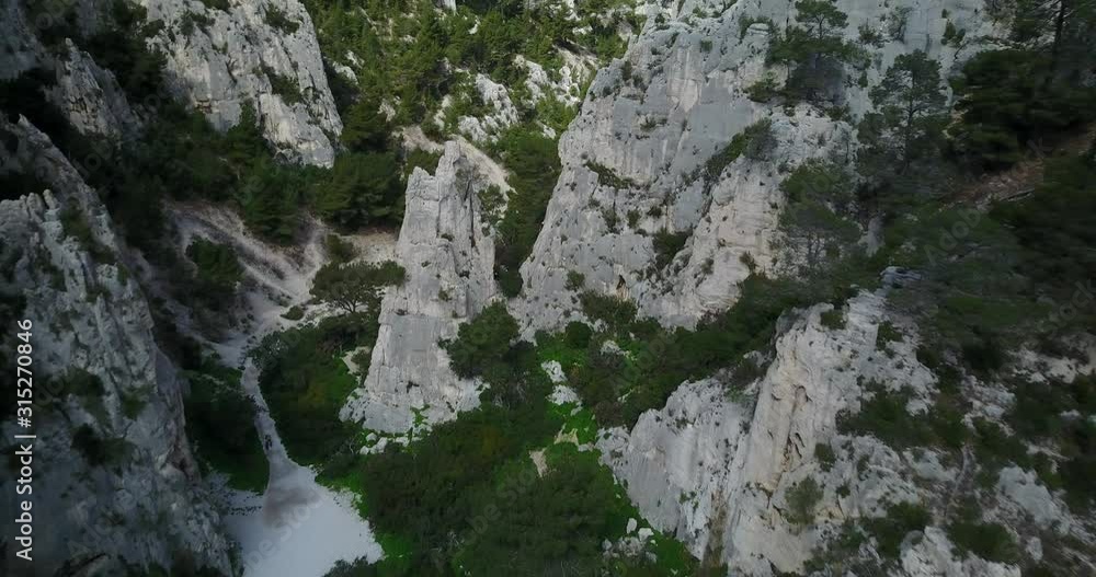 aerial towards people climbing in Provence rocky cliffs and bays aerial towards people climbing in Provence rocky cliffs and bays