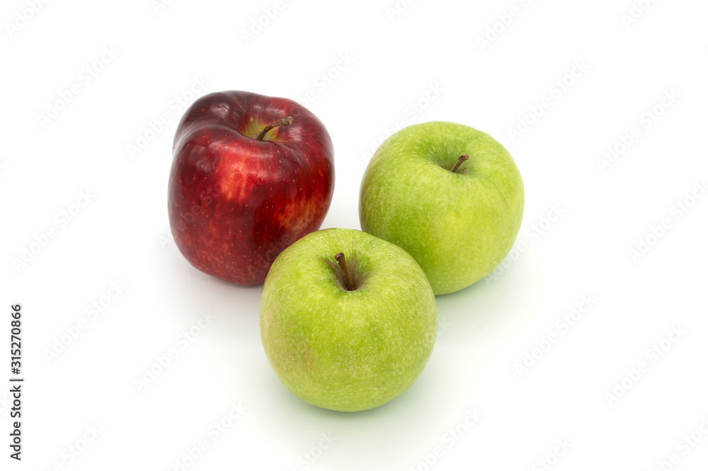 Two green apples and one red apple isolated on white background