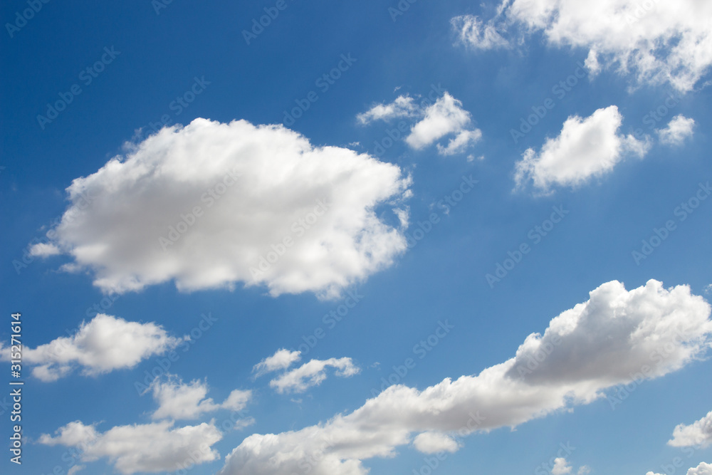 Fototapeta premium Bright blue sky with white clouds for background or wallpapers