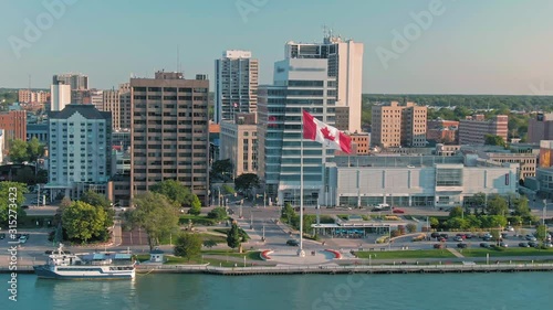 Aerial: Downtown Windsor and the Detroit River at sunset. Ontario, Canada