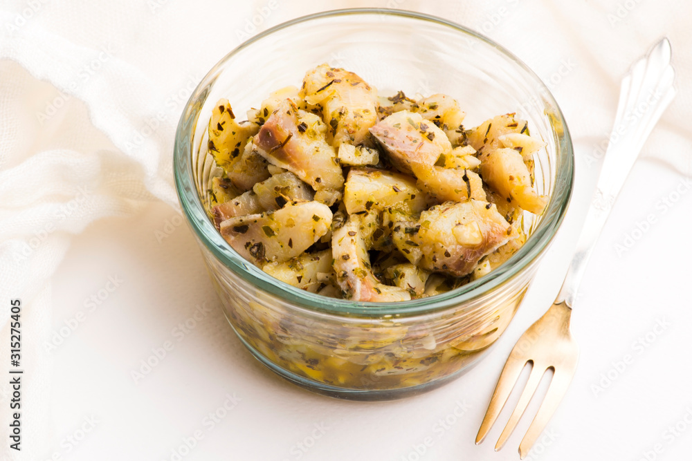 Herring salad with garlic, herbs and olive oil Herring salad with garlic, herbs and olive oil