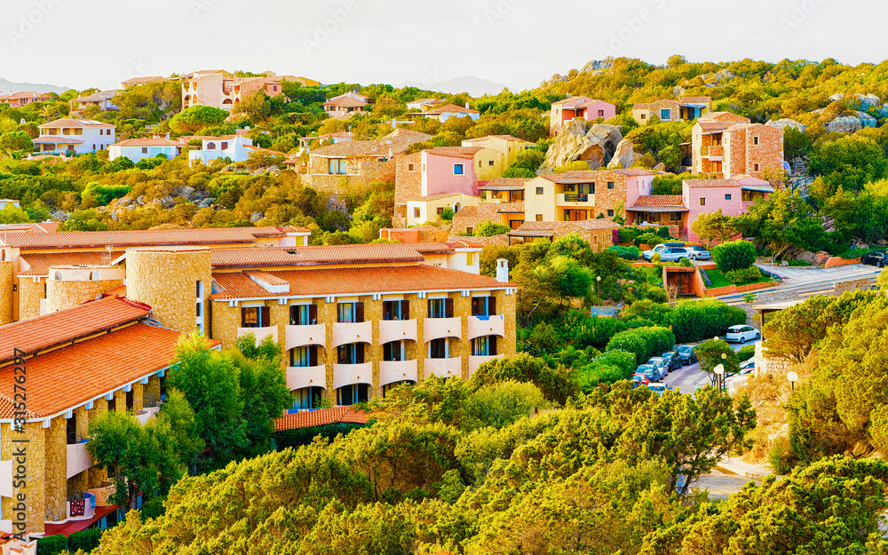 Fototapeta premium Landscape and scenery of Baja Sardinia luxury resort on at sunset in the evening, Sardegna island in Italy summer. Olbia province. Villa at Mediteranean sea