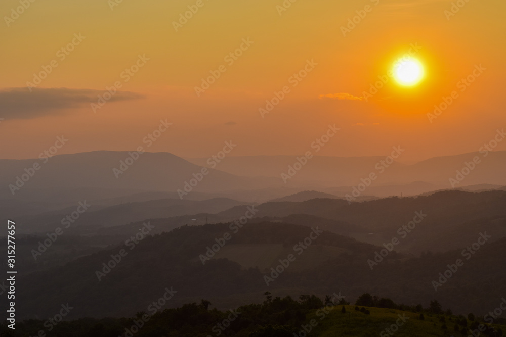 Fototapeta premium Sunset Sunrise in mountain landscape. Mountain sunset. Landscape. Mountains. Sunset. Beautuful sunset.