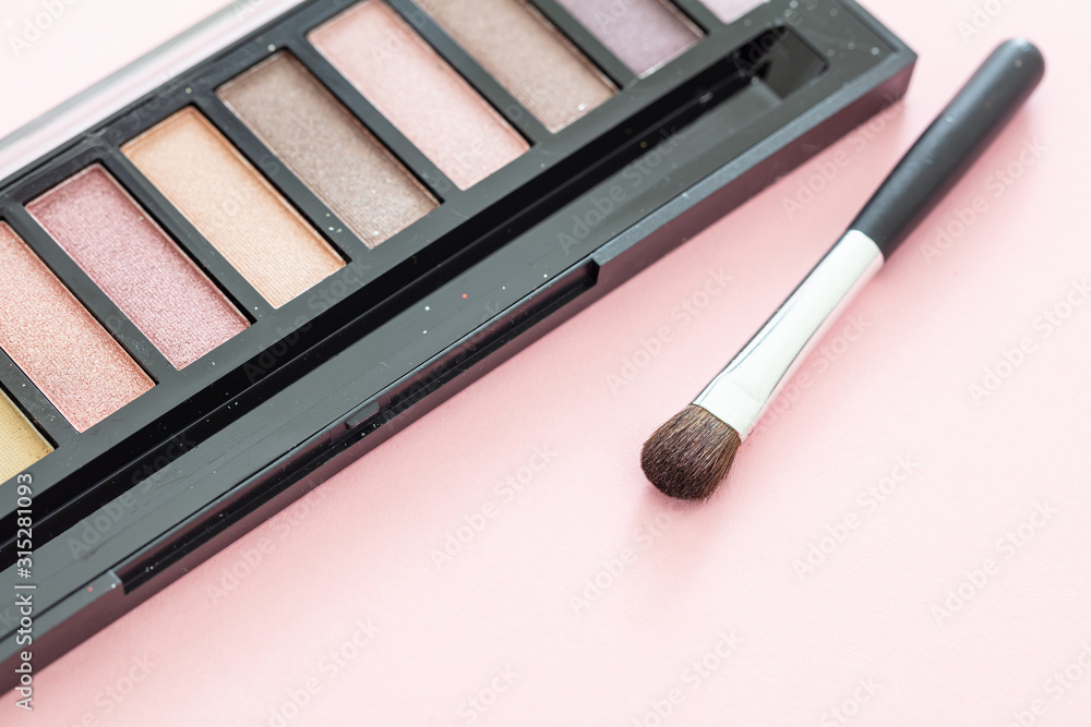 Eyeshadow pallete kit against pink background, copy space Eyeshadow pallete kit against pink background, copy space