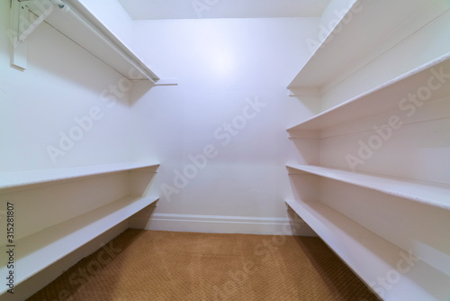 White walk-in closet or wardrobe bright interior