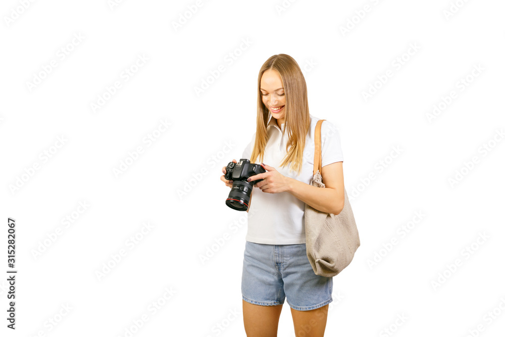 Young woman with camera isolated on white.