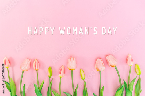 Woman Day composition. Tulip flowers on pink background Flat lay top view copy space