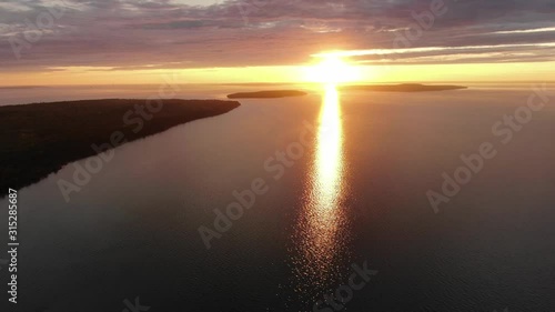 Weekend trip to Bois Blanc Island next to Mackinac Island with Warm Summer Sunset drone aerial shot with mavic pro 2 photo