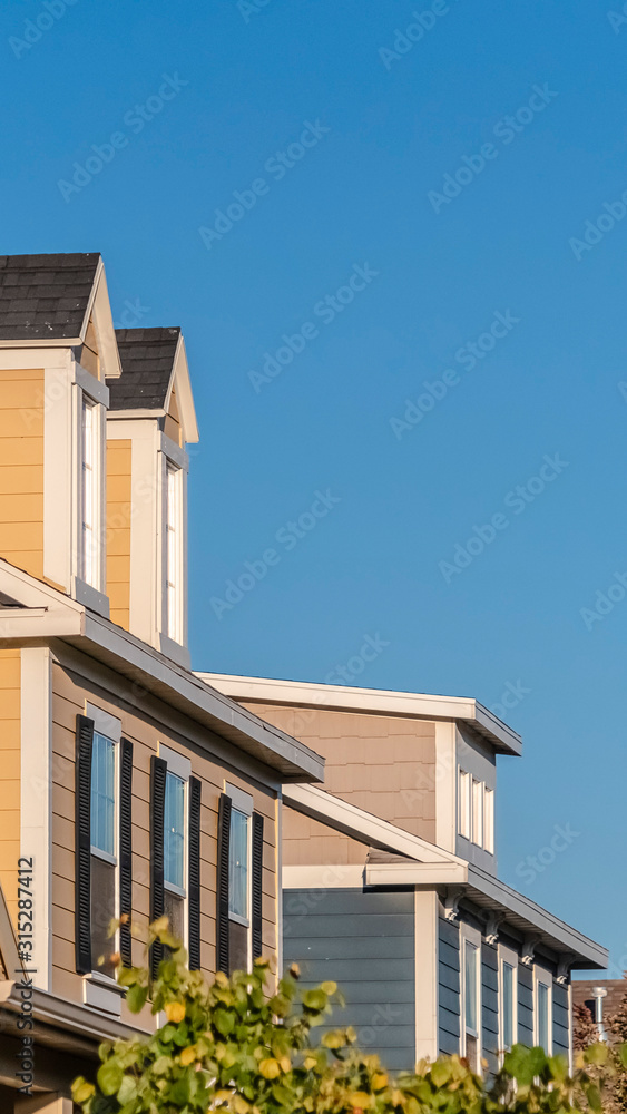 Vertical Row of upper floor facades of urban homes