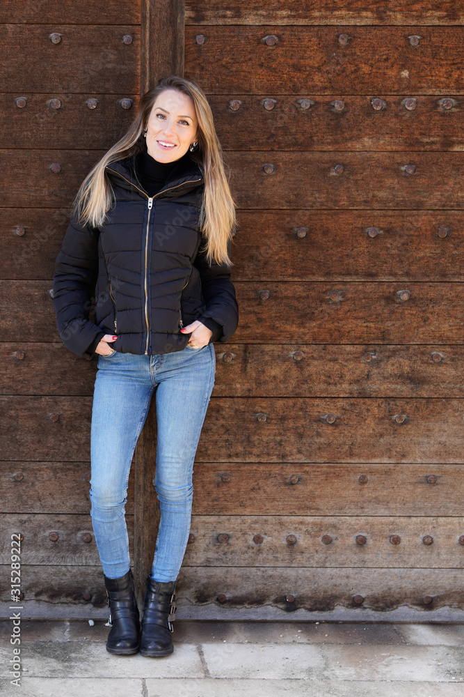 Girl wearing black jacket posing against street urban clothing style photography full beautiful blonde young woman slim Girl wearing black jacket posing against street urban clothing style photography full beautiful blonde young woman slim