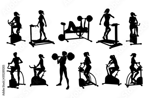 A woman in silhouette using pieces of gym fitness equipment and machines set