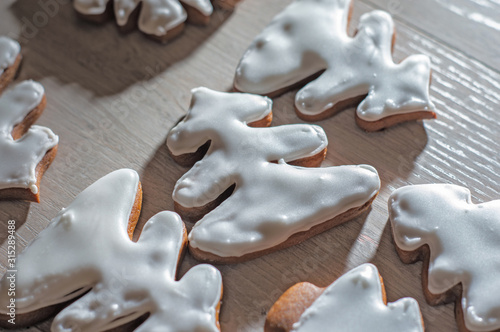 Handmade festive gingerbread cookies in the form of stars,staff,Christmas trees.on a light countertop.