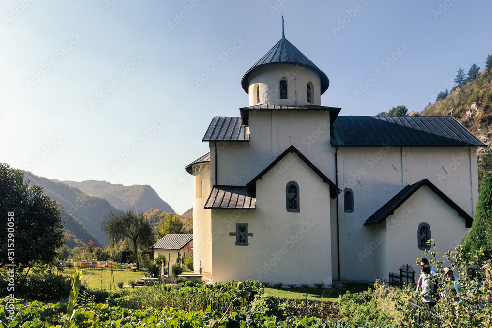  Orthodox Moraca monastery in Montenegro. Landscape with Orthodox church  and cloister garden.