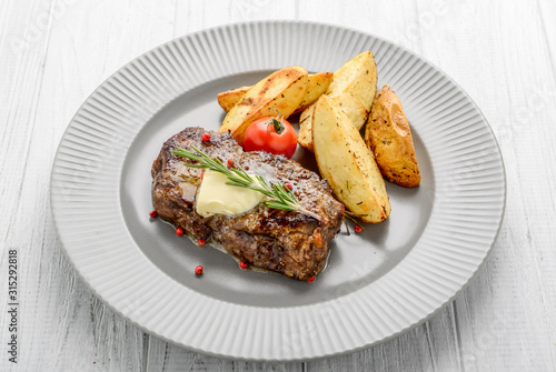 Useful and tasty food, grilled beefsteak with french fries