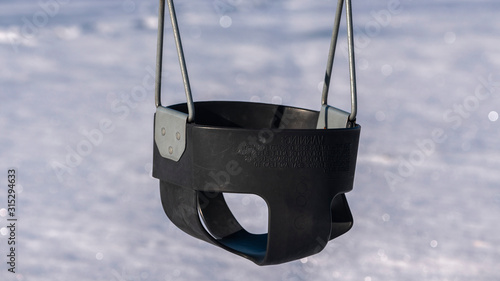 Panorama Swing seat in a kids playground in winter
