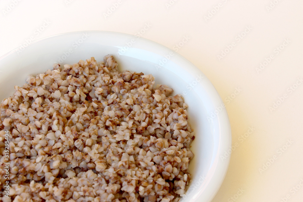 for breakfast in a plate delicious healthy friable buckwheat porridge, rich in minerals and vitamins of traditional Russian cuisine for breakfast in a plate delicious healthy friable buckwheat porridge, rich in minerals and vitamins of traditional Russian cuisine