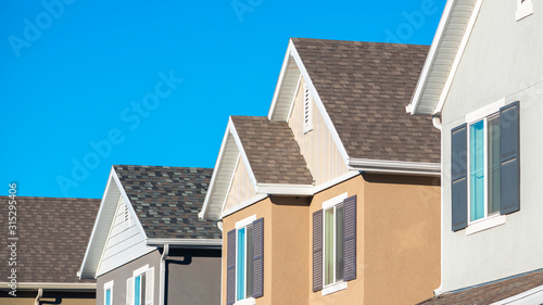 Panorama frame Row of upper floor house facades with shutters