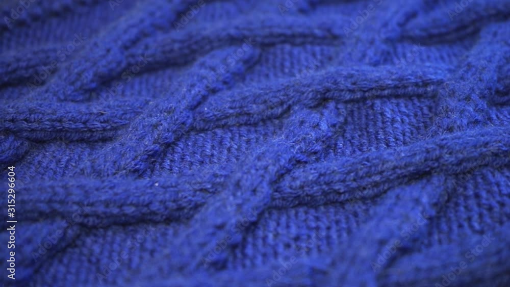 The texture of the fabric. Blue knitted texture. Close-up. Can be used as a background. HD The texture of the fabric. Blue knitted texture. Close-up. Can be used as a background. HD