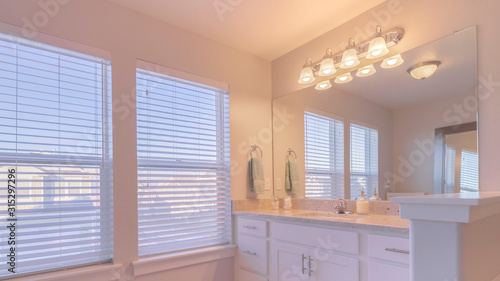 Panorama frame Fitted white bathroom interior in an urban house