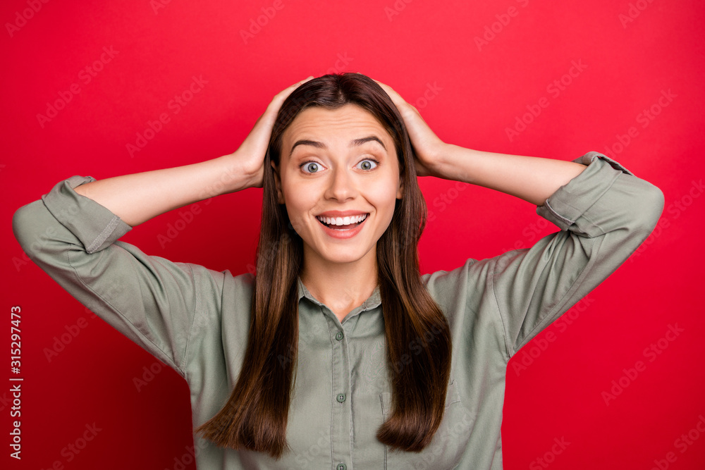 Close-up portrait of her she nice attractive winsome lovely cheerful cheery amazed straight-haired girl wearing khaki shirt wow expression isolated over bright vivid shine vibrant red color background Close-up portrait of her she nice attractive winsome lovely cheerful cheery amazed straight-haired girl wearing khaki shirt wow expression isolated over bright vivid shine vibrant red color background