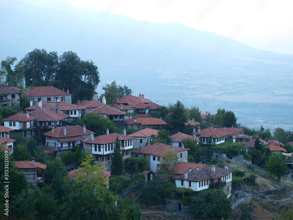 A traditional greek village on the side of a hill