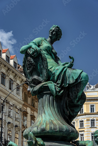 Ancient gods and allegories of water - view of the Donnerbrunnen Fountain at Neuer Markt square in Vienna, Austria.