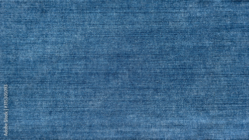 Blue denim textured background. Closeup texture and pattern of jeans fabric