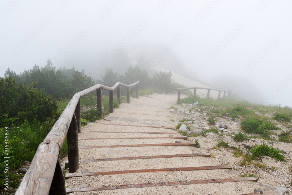 Stairway high in alpine mountains on a foggy morning. Stairway high in alpine mountains on a foggy morning.