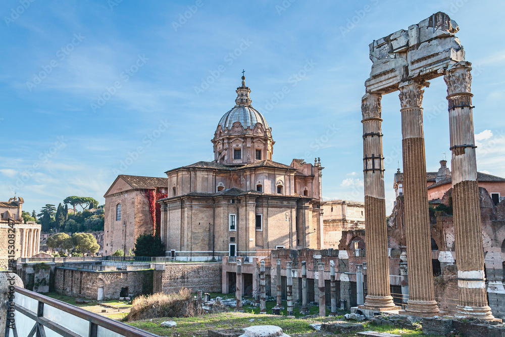 antique columns of the forum Julius Caesar on a sunny summer day