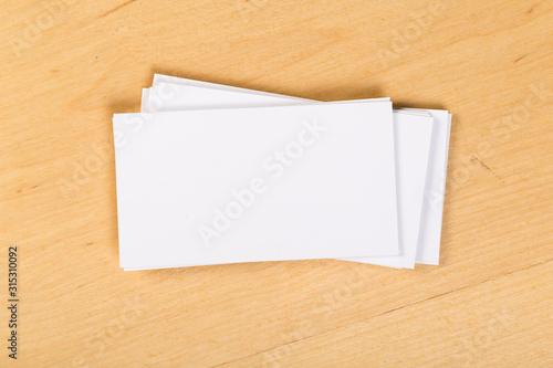 Photo of blank business cards on a general background. Template for identifier. View from above. mock up