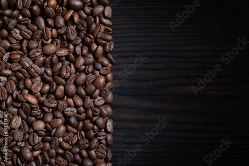 Coffee beans on wood background