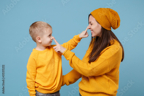 Photography Woman in yellow clothes have fun posing with cute child baby boy 4-5 years old