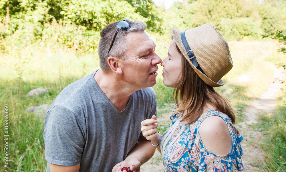pair of lovers kissing in the forest